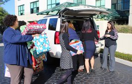 Corporate Delivering Gifts to Volunteers of America