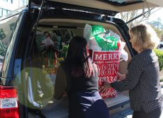 Corporate Delivering Gifts to Volunteers of America